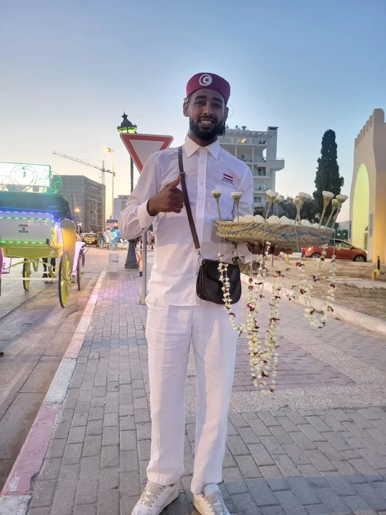 What to buy in Tunisia – local vendor selling jasmine flowers in Medina