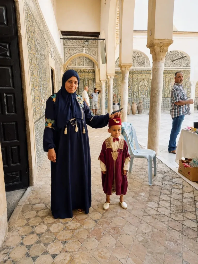 Traditional clothing inside Sidi Sahbi Mausoleum in Kairouan during Kairouan El Djem tour Tunisia